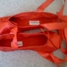 red satin ballet flats