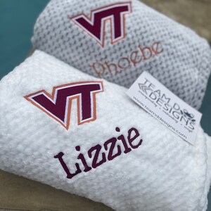 May include: Two white fleece blankets with embroidered VT logos and personalized names. The top blanket says "phoebe" and the bottom blanket says "Lizzie".