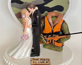 Wedding Cake Topper Orange Hunting Vest Themed Hunting Rifle Beautiful Long-Haired Bride Groom Camo Heart Background Fun Groom's Cake Top