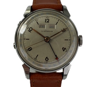 Authentieke vintage E. Gubelin drievoudige datum kalender horloge originele wijzerplaat prachtige stalen kast jaren 40