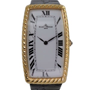 Baume & Mercier, grande corde allongée courbe en or jaune 18 carats avec papiers 197