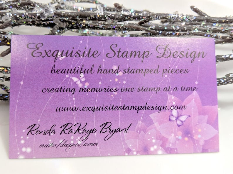 May include: A business card with a purple gradient background features the text "Exquisite Stamp Design." The card includes the phrases "beautiful hand stamped pieces" and "creating memories one stamp at a time."