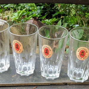 May include: Four clear glass pint glasses with a red and white logo that says "Whitbread Pale Ale" and a small image of a fox.