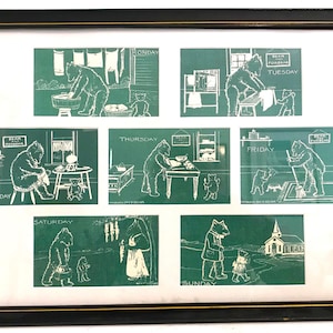 May include: Framed artwork featuring seven green panels, each depicting a bear in various daily activities, labeled for each day of the week. The artwork is framed in a black frame with a white mat.