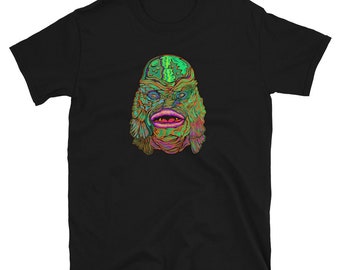 May include: Black t-shirt with a colorful graphic print of the Creature from the Black Lagoon. The creature's face is green, blue, and orange.
