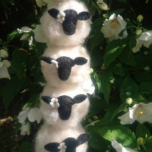 Needle felted sheep and daisy hanging ornament/mobile. Made using wool from my organic flock