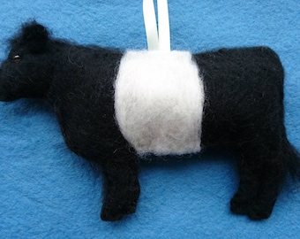 Felt Belted Galloway Cow hanging ornament. Needle felted and hand embroidered detail.Filled with wool from my certified organic sheep flock.