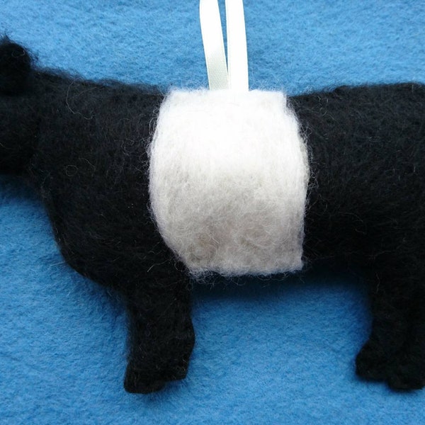 Felt Belted Galloway Cow hanging ornament. Needle felted and hand embroidered detail.Filled with wool from my certified organic sheep flock.