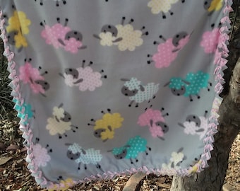 Baby Lambs Baby Throw in 100% polyester fleece, 20"W x 32"L. Reverse is light pink Minky fleece. Very sweet & oh so soft!