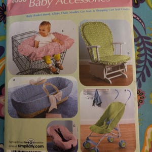 May include: Simplicity sewing pattern number 4636 for baby accessories. The pattern includes instructions for making a shopping cart seat cover, glider chair cover, stroller cover, car seat cover, and baby basket insert. The pattern shows a variety of colors and patterns, including pink, green, blue, and white.