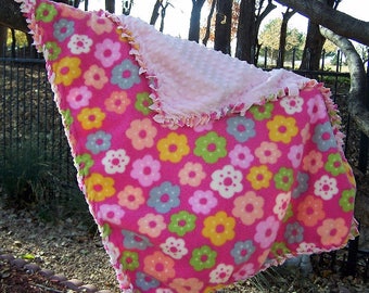 Pastel Flowers Baby Throw in 100% polyester fleece, 20"W x 32"L. Reverse is light pink Minky fleece. Only one. Oh so soft!