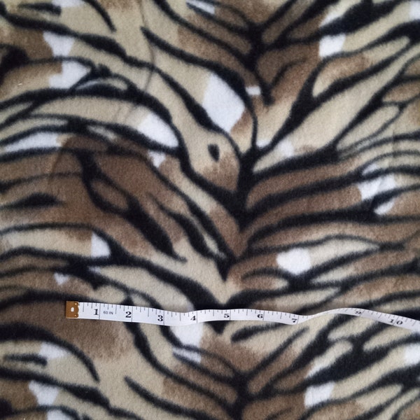 Animal Print Fabric.  100% polyester fleece.  2 and 1/4 yards. One continuous length.