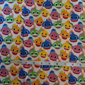 Baby Shark characters.  100% cotton fabric. One yard 42&quot; x 36&quot;.
