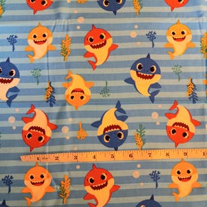 Baby Shark characters.  100% cotton fabric. One yard 42&quot; x 36&quot;.