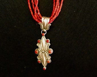 Red coral Native American pendant on strands of white heart red beads