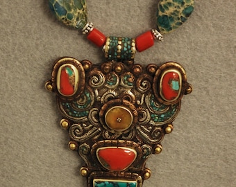 Vintage Tibetan pendant strung with turquoise, red coral, silver and brass
