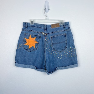 Painted Sun Shorts | Waist: 29 | Tangled Lantern | Tangled | Tangled Sun | Tangled Shorts | Rapunzel | Rapunzel Shorts | Disney Denim Shorts