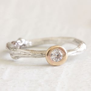 Twig diamond engagement ring in sterling silver and 14k gold. Gold bezel sterling silver band, round diamond.