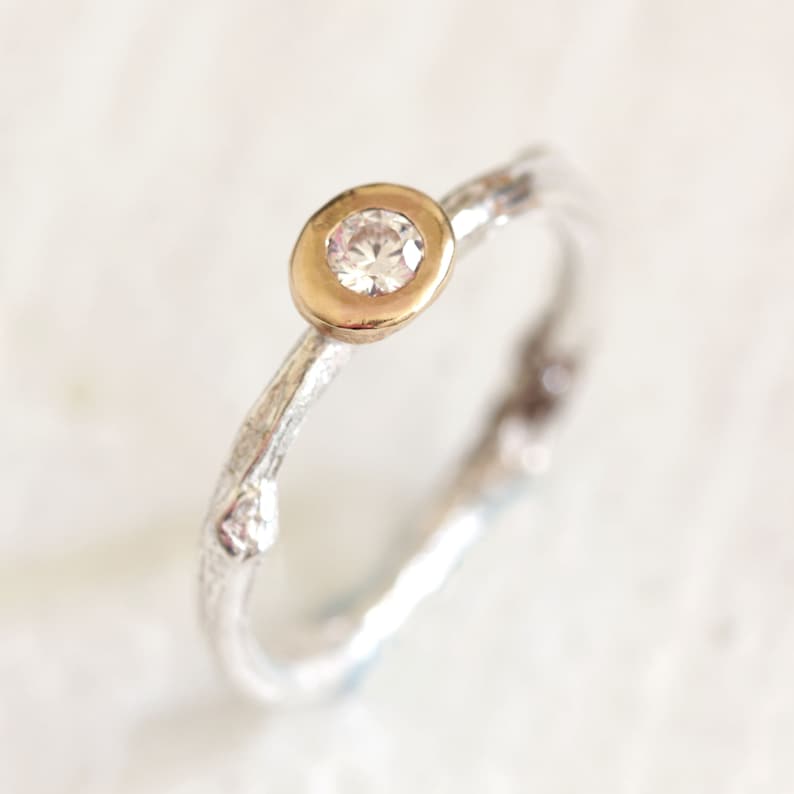 Twig diamond engagement ring in sterling silver and 14k gold. Gold bezel sterling silver band, round diamond.