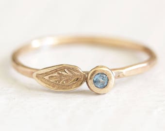 Gold petal leaf pebble ring with Swiss Blue Topaz