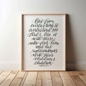 May include: A framed print with a black and white calligraphy quote from Psalm 103:17. The quote reads "But from everlasting to everlasting, the Lord's love is with those who fear him and his righteousness with their children's children."