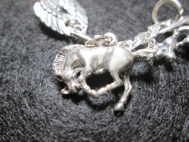 Charm Bracelet.. 6 34 inches long...sterling silver.. INV#20
