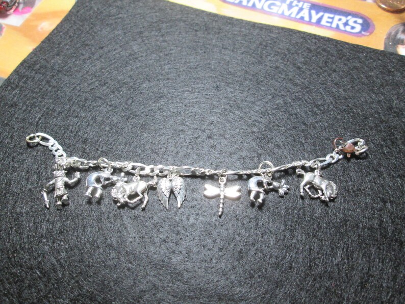 Charm Bracelet.. 6 34 inches long...sterling silver.. INV#20