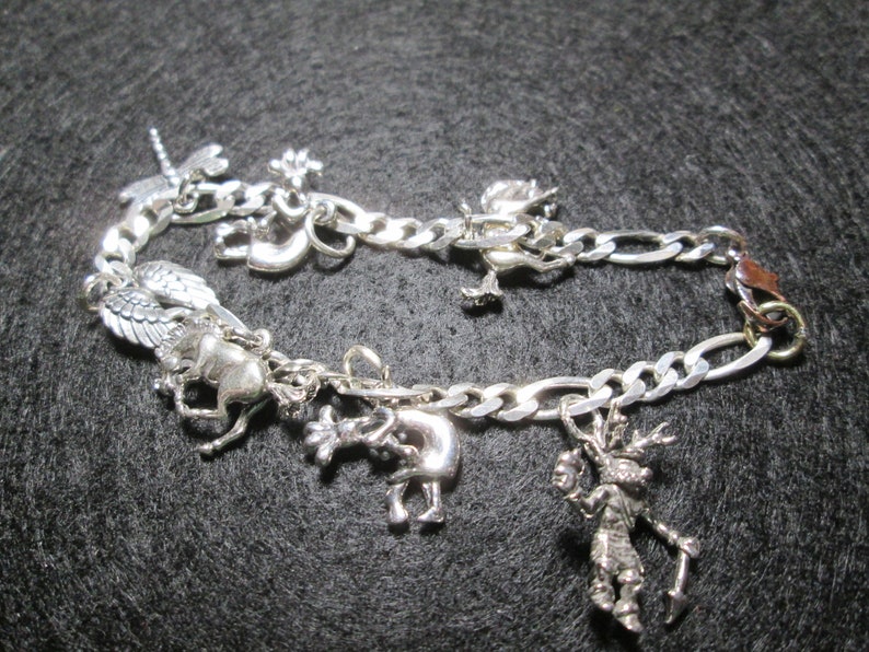 Charm Bracelet.. 6 34 inches long...sterling silver.. INV#20