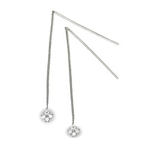 May include: A pair of silver dangle earrings with a cluster of clear cubic zirconia stones at the end of each chain.