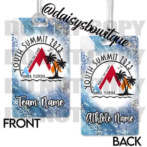 May include: A blue and white luggage tag with a mountain design and the text "Youth Summit 2023" and "Making the Climb". The tag has a space for a team name on the front and an athlete name on the back.