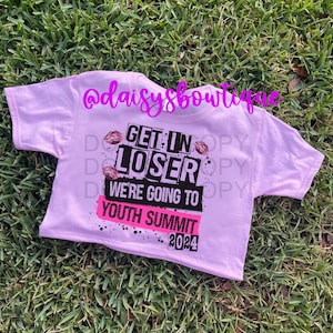 May include: Pink youth summit t-shirt with black text that reads "Get in Loser We're Going to Youth Summit 2024".