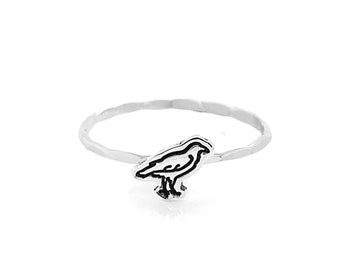 Crow charm cut-out ring.