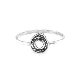May include: A silver ring featuring an ouroboros design, a snake eating its own tail. The snake is detailed with etched patterns, and the ring band is thin and polished. The ring is set against a white background.