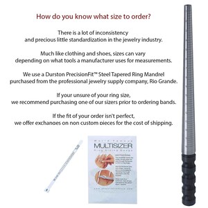 May include: A silver ring sizer tool with black markings and a black handle. The tool is used to measure the size of a person's finger for rings. The text on the tool reads "World Famous Multisizer Ring Sizing Gauge".