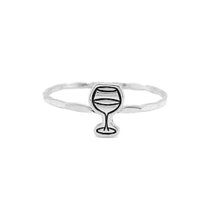 May include: A silver ring with a simple black outline of a wine glass.