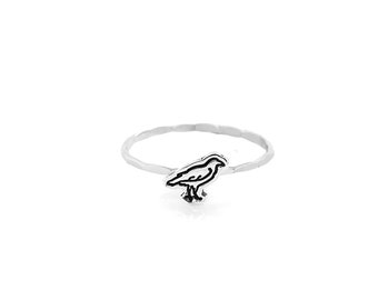 Crow charm cut-out ring.