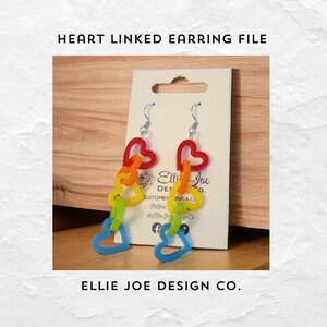 May include: Rainbow heart-shaped linked earrings with silver hooks. The earrings are displayed on a white card with the text "Ellie Joe Design Co. Custom by Monica Co. Follow @Ellie Joe Design Co."