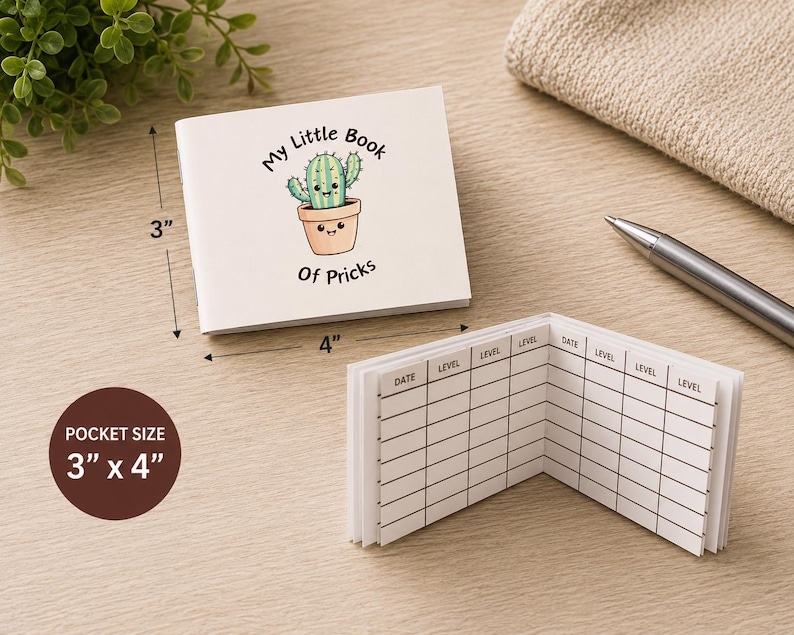 May include: A white pocket-sized notebook measuring 3 inches by 4 inches. The cover features a cartoon cactus in a pot with the text My Little Book Of Pricks. The interior pages contain a printed grid with columns labeled Date and Level.