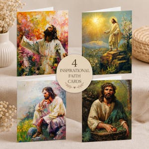 May include: A set of four folded greeting cards featuring religious artwork of Jesus in various settings, including a garden, a mountain landscape, and a field. A circular label in the center displays the text 4 INSPIRATIONAL FAITH CARDS.