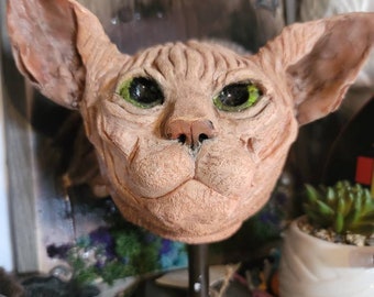 Sphinx cat head sculpture