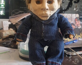 Scary stalker doll wearing a sort of William Shatner mask?