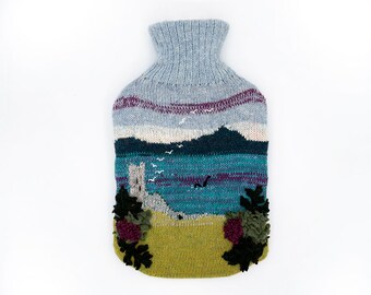 Knitted Lambswool hot water bottle cover with charming Loch Ness scene
