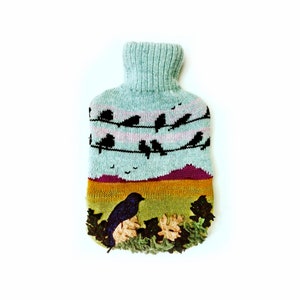Knitted Lambswool hot water bottle cover with birds on a wire design: bottle included