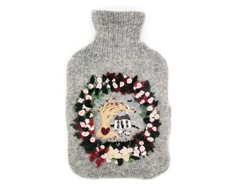 Knitted Lambswool hot water bottle cover with wreath and house design