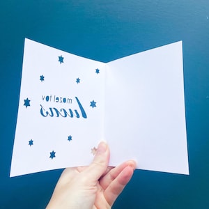 hand cut mazel tov card with jewish stars