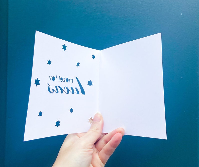 hand cut mazel tov card with jewish stars