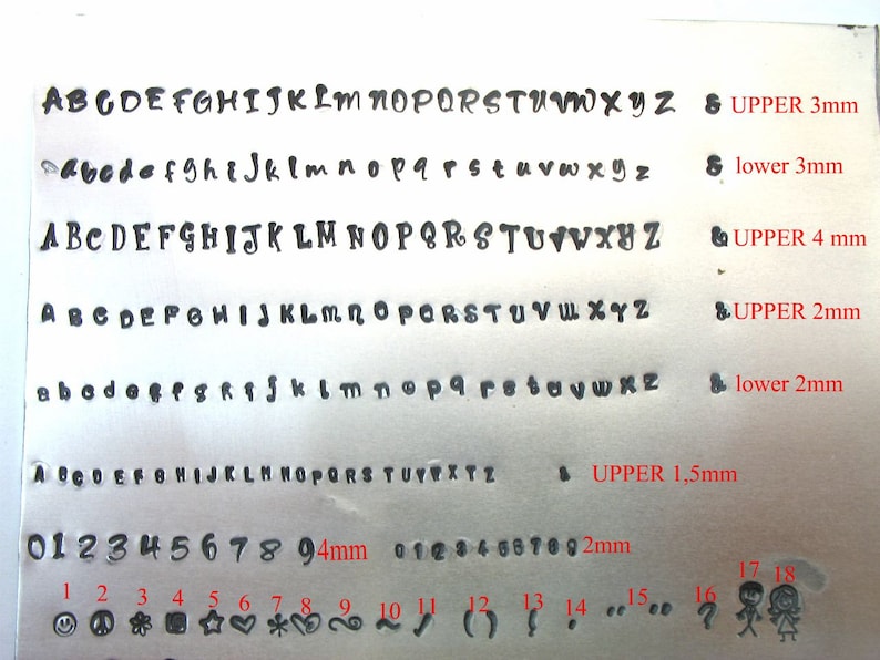 May include: A metal sheet displaying various fonts and symbols for stamping. The image includes uppercase and lowercase alphabets in different sizes, along with numbers and symbols. Text indicates sizes in millimeters.