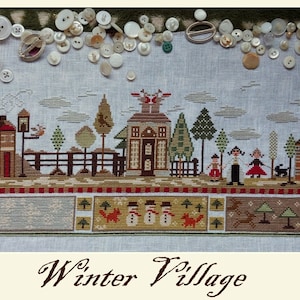 May include: A cross-stitch embroidery depicting a winter village scene with houses, trees, snowmen, and foxes. The embroidery is framed with a red and white border and the text "Winter Village" is written below the image.