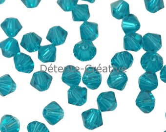 50 Pcs - Perles toupies 5328 - Cristal de SWAROVSKI Blue Zircon 4 mm