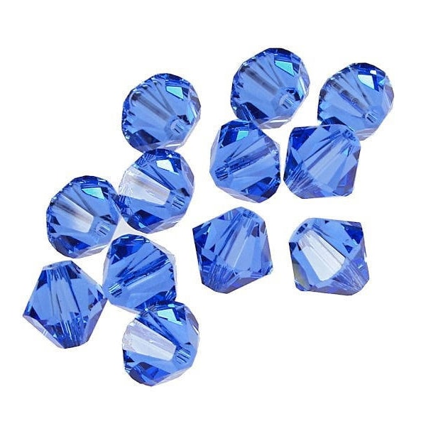 50 Pcs - Perles toupies 5328 - Perles cristal de SWAROVSKI Saphir 4 mm